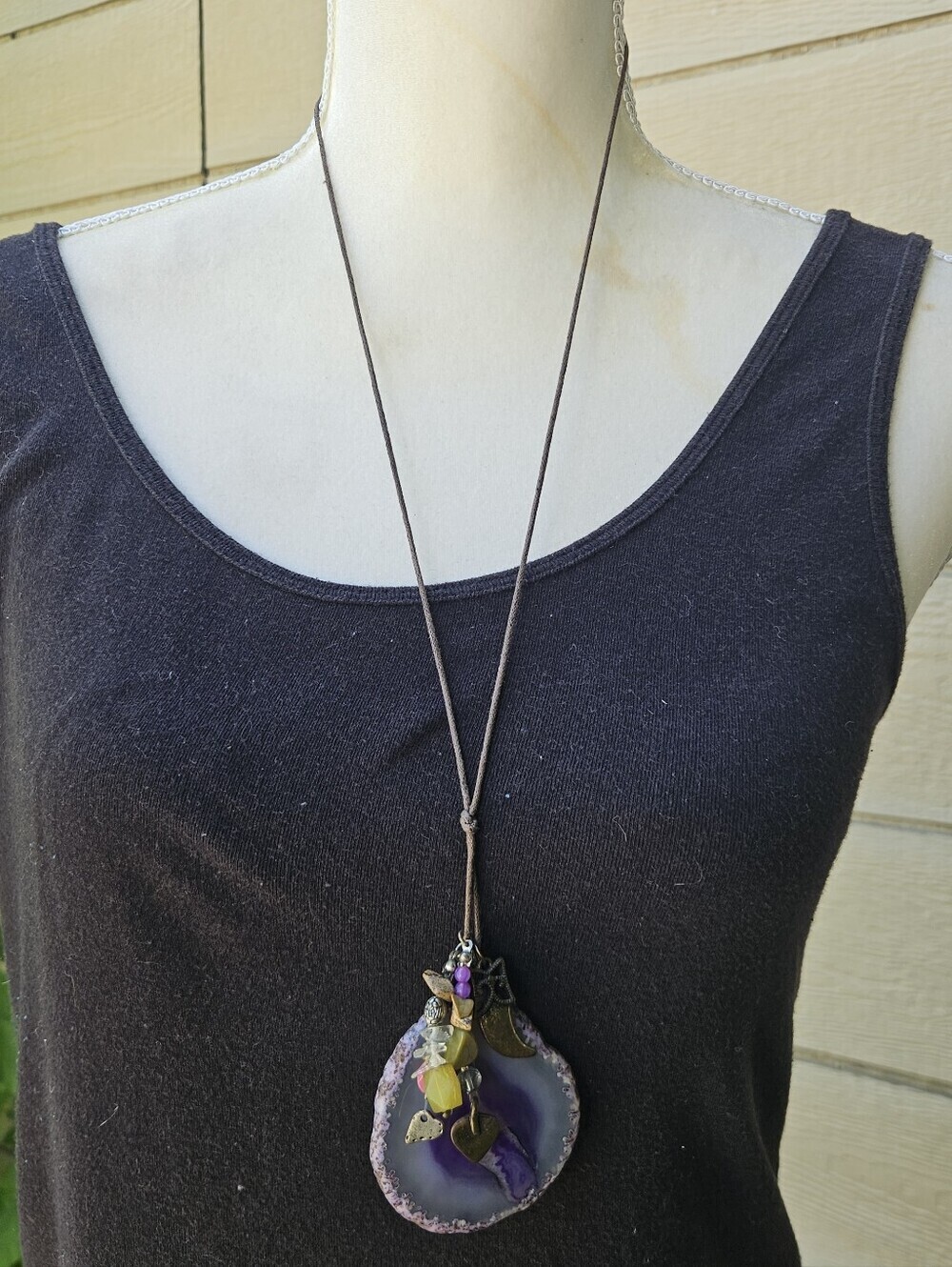 American Eagle brown cord necklace with purple stone slice and charms